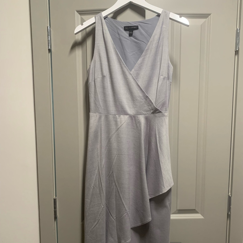 Mid length grey office dress.